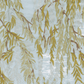 Willows Silver Collection by Caspari features yellow-green willow branches with slender leaves on a light blue backdrop with subtle waves—perfect for elevating paper products or table settings at your next celebration.