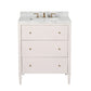The Conrad Vanity Collection by Made Goods features a white floating bathroom vanity with soft-close drawers, a marble countertop, and brass faucet and hardware, shown against a white background.
