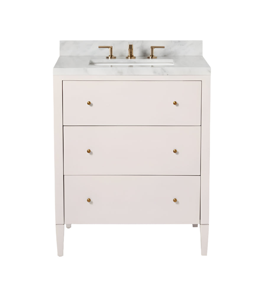 The Conrad Vanity Collection by Made Goods features a white floating bathroom vanity with soft-close drawers, a marble countertop, and brass faucet and hardware, shown against a white background.