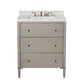 The Conrad Vanity Collection by Made Goods features a modern floating design with three soft-close gray drawers, a white marble countertop, and gold faucet fixtures.