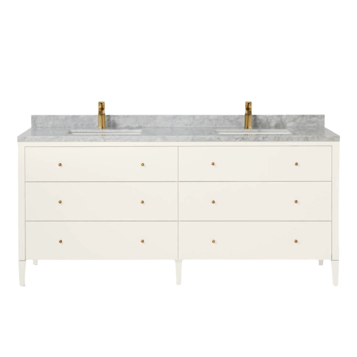 The Conrad Vanity Collection by Made Goods features a white double sink base, soft-close drawers with brass knobs, a marble countertop, and two gold-colored faucets.