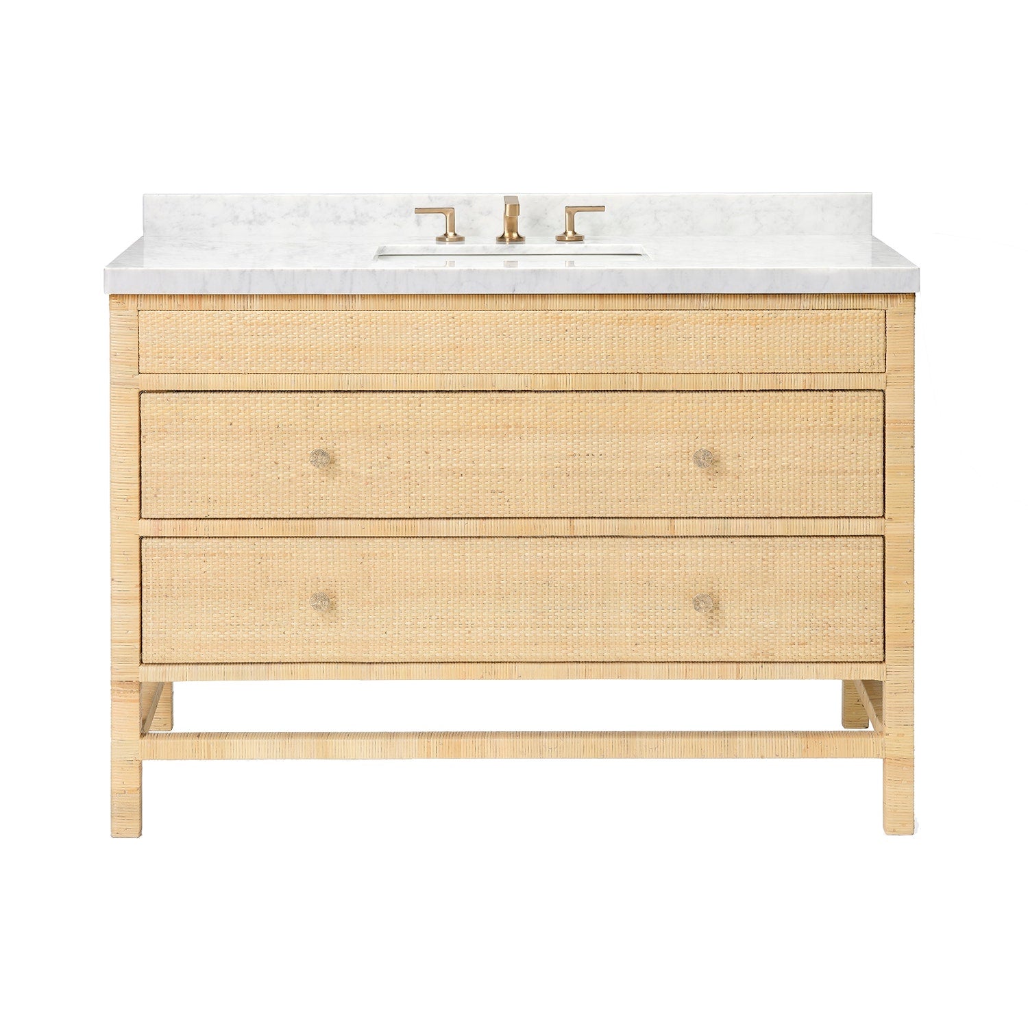 The Isla Vanity Collection by Made Goods showcases style and warmth with its rattan design, marble countertop, brass faucet, and three woven drawers in a light wood finish—perfect for elevating your bathroom.