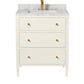 The Jarin Vanity Collection by Made Goods features a white freestanding vanity with three drawers, brass handles, a marble countertop, and a brass faucet—an elegant addition to any bathroom.