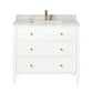 The Jarin Vanity Collection by Made Goods features a white floating vanity with three drawers, marble countertop, built-in sink, and brass faucet and handles, displayed against a plain white background.