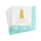 Caspari Bunny Kisses and Easter Wishes Cocktail Napkins feature a triple-ply design in white and turquoise, with a gold bunny silhouette and the phrase "Bunny Kisses and Easter Wishes" printed on them.