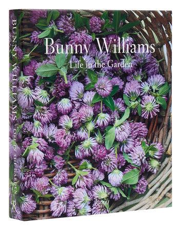 Book cover for Bunny Williams Book Signing by HIVE Home, Gift and Garden, known for interior design, showing a basket of purple clover flowers and green leaves.