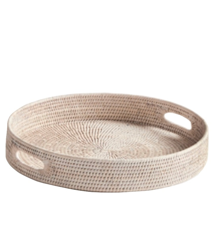 The Burma Whitewash Rattan Round Ottoman Tray Collection by Napa Home & Garden features a round tray with raised sides and oval cut-out handles, ideal for home decor, shown on a white background.