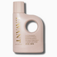A pale pink bottle of L’Avant Collective Blushed Bergamot laundry detergent with a large circular handle, gold lettering, and text indicating it provides up to 35 washes.
