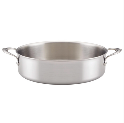 The Hestan Thomas Keller Commercial Clad Stainless Steel Rondeau, 6qt, features a wide, shallow design with two side handles—an eco-conscious cookware option shown on a plain white background.