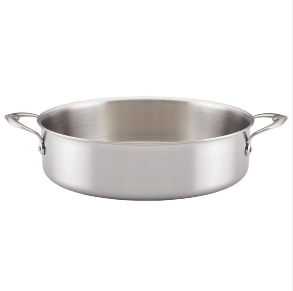 The Hestan Thomas Keller Commercial Clad Stainless Steel Rondeau, a 6qt Italian-crafted shallow pan, features eco-conscious artistry with two sturdy side handles, combining style and functionality.