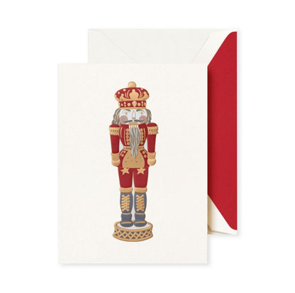 The Crane Foil Embossed Nutcracker Card Set features a red and gold foil-embossed nutcracker design with a matching envelope lined in festive red.