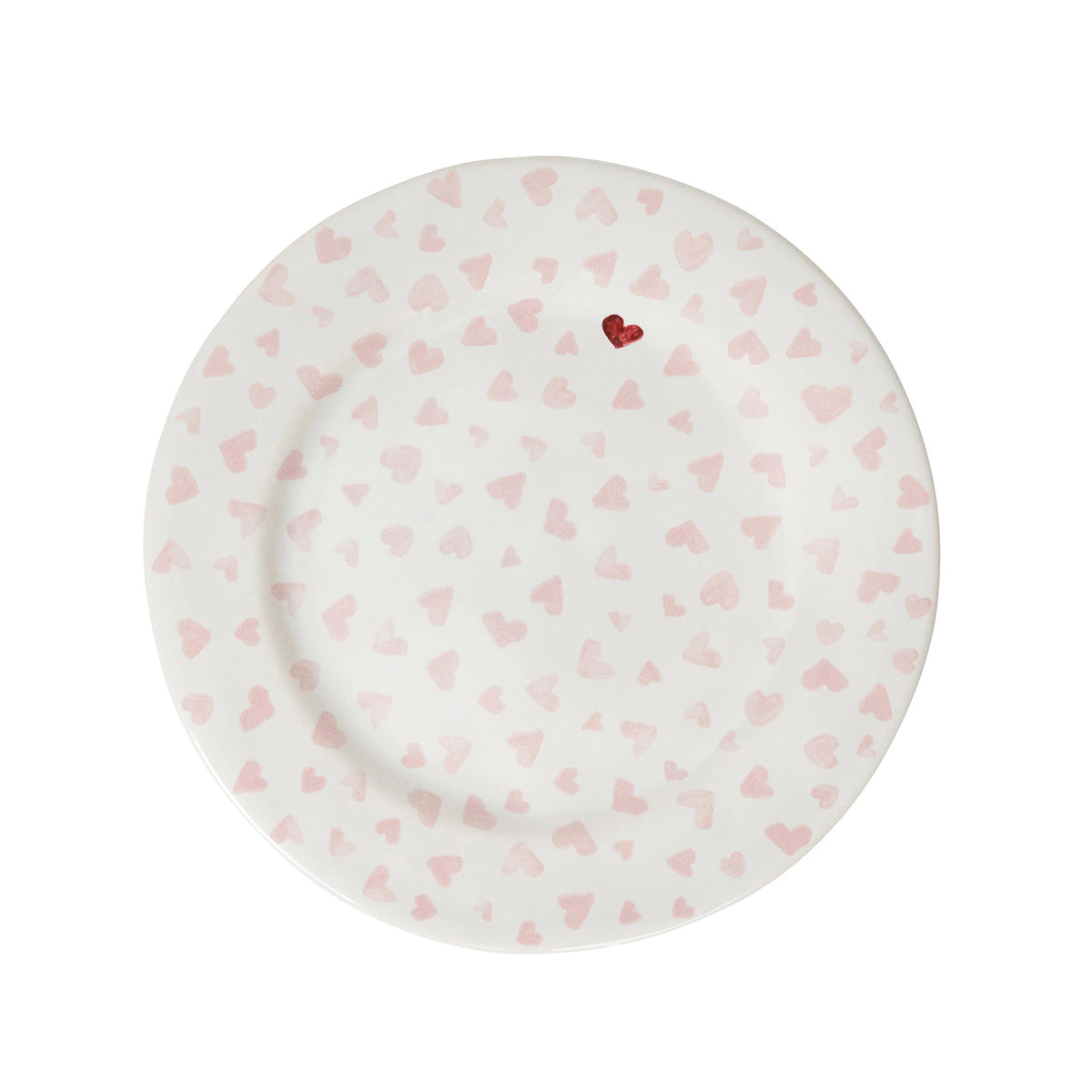 The Juliska Love You More Decor and Tabletop Collection features a white ceramic dessert plate with light pink hearts and a single red heart near the rim, adding charm to your sweetheart tableware. Photographed on a white background.