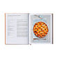 An open copy of The Italian Bakery by Phaidon shows an apple and cinnamon lattice pie recipe on one page and a photo of the finished dessert with a pie server on the other—ideal for patisserie recipe enthusiasts.
