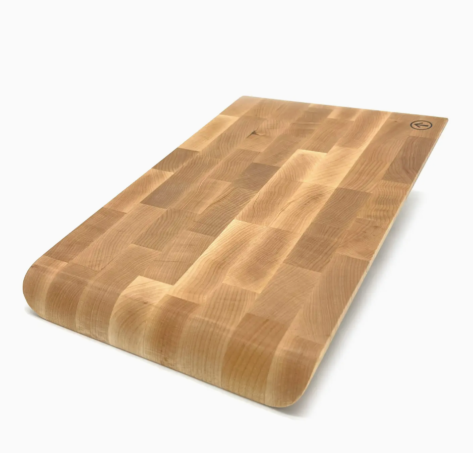 The J.K. Adams Infinity Edge Maple Cutting Board features a rectangular end grain design with rounded edges and a smooth finish for durability, shown on a white background.