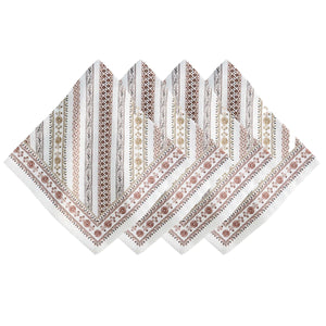 Four Seville Stripe cotton sateen napkins by Juliska are arranged in a fan shape. Each napkin showcases vertical stripes with floral and geometric patterns in earthy tones, inspired by the hand-painted tiles of the Spanish countryside.
