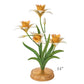 The Meadow Walk Daffodil Candle Holder by Juliska features five yellow and white flowers with green leaves on a gold base, standing 14" tall—an elegant, whimsical piece from the Juliska Meadow Walk Daffodil Collection.