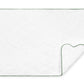 The Matouk Cairo Scallop Bath Collection mat features a luxurious white quilted design with a scalloped edge and green trim, crafted from long-staple cotton, partially folded at one corner.