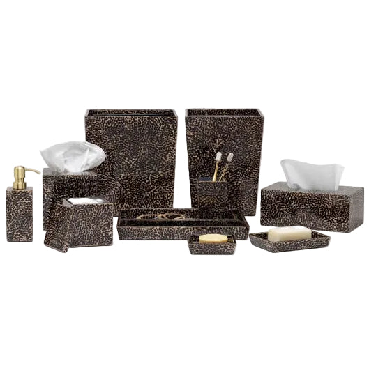 The Pigeon & Poodle Callas Bath Collection offers dark brown bathroom accessories—including tissue boxes, soap dispensers, trays, toothbrush holders, and waste bins—with a chic textured dot pattern inspired by lacquered eggshell.