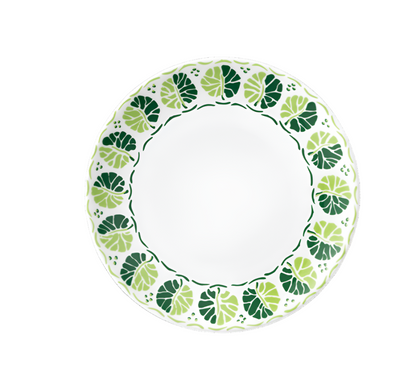 The Cobblers Cove Calypso Dinnerware Collection by Royal Crown Derby features a round white plate with a decorative green leaf border, evoking a Caribbean vibe and adding vibrant elegance to your table.