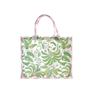 The Addison Ross Palm Beach Tote Bag features pink and green botanical prints, two top handles, and a pink-striped trim on cotton canvas, shown against a white background.