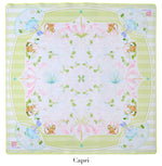 A square scarf from the Oh My Mahjong Mat Collection by Oh My Mahjong, featuring a symmetrical design with fans, umbrellas, and foliage in pastels on a pale background. Reminiscent of Mahjong mats, the border reads "Oh Mai Oh My!" and "Capri.