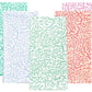 Caspari's Block Print Leaves Napkin Collection features four handcrafted cotton napkins with leafy patterns in green, light blue, mint, and coral pink, beautifully highlighting the charm of Indian textiles.