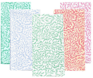 Caspari's Block Print Leaves Napkin Collection features four handcrafted cotton napkins with leafy patterns in green, light blue, mint, and coral pink, beautifully highlighting the charm of Indian textiles.