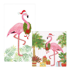 The Caspari Christmas Flamingos Napkin Collection features a pink flamingo in a Santa hat and wreath, standing among tropical plants and gifts—ideal for festive guest towel or triple-ply cocktail napkins.