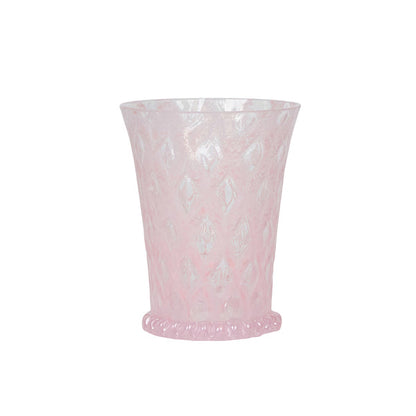 The Juliska Trellis Drinkware Collection features a translucent pink Czech glass tumbler with a diamond pattern and beaded base—an elegant addition to any glassware collection.
