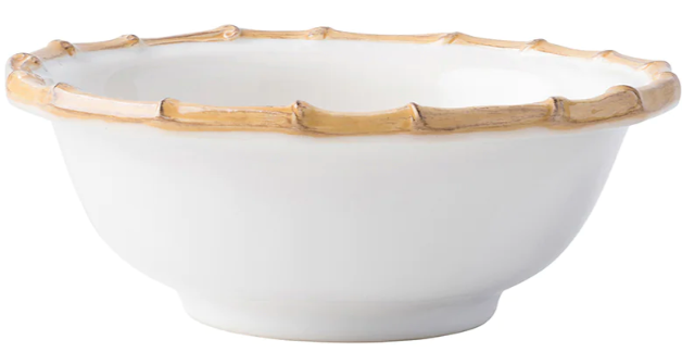 The Juliska Classic Bamboo Dinnerware Collection features a white ceramic bowl with a glossy finish and bamboo-inspired rim, bringing casual elegance and international flair to your table.