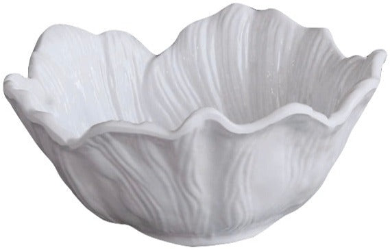 A white ceramic bowl with a ruffled, textured edge inspired by the elegant Beatriz Ball Vida Lettuce Dinnerware Collection, featuring a surface that resembles a flower or cabbage leaf.