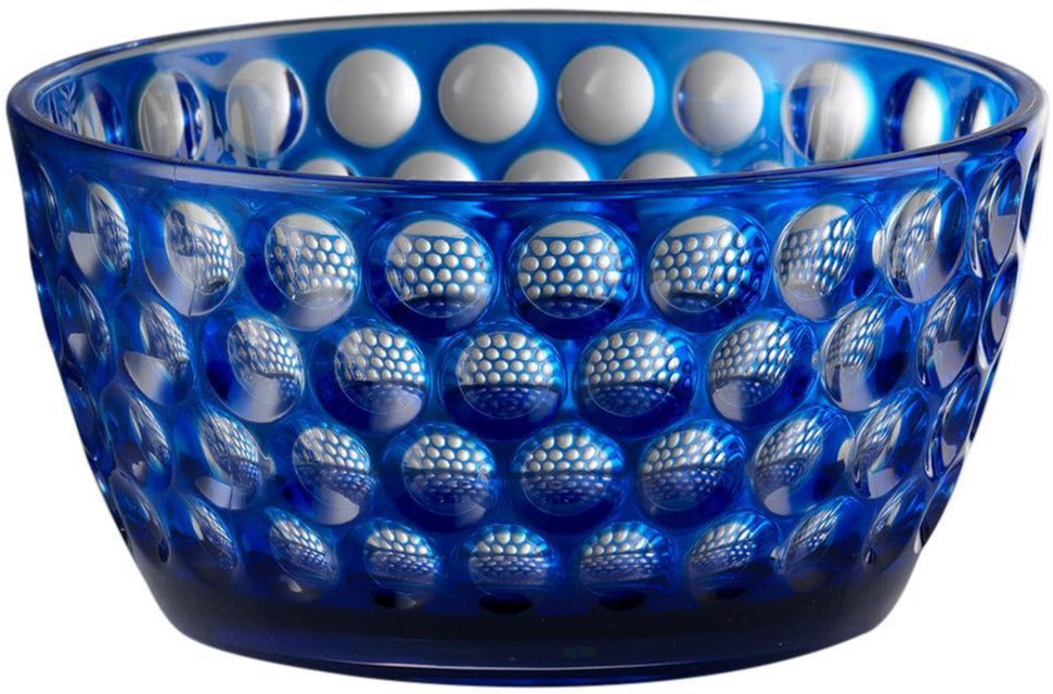 The Mario Luca Giusti Lente Acrylic Dinnerware Collection features a blue bowl with raised, rounded bumps—ideal for outdoor entertaining or pairing with other blue acrylic pieces for a stylish, coordinated setting.