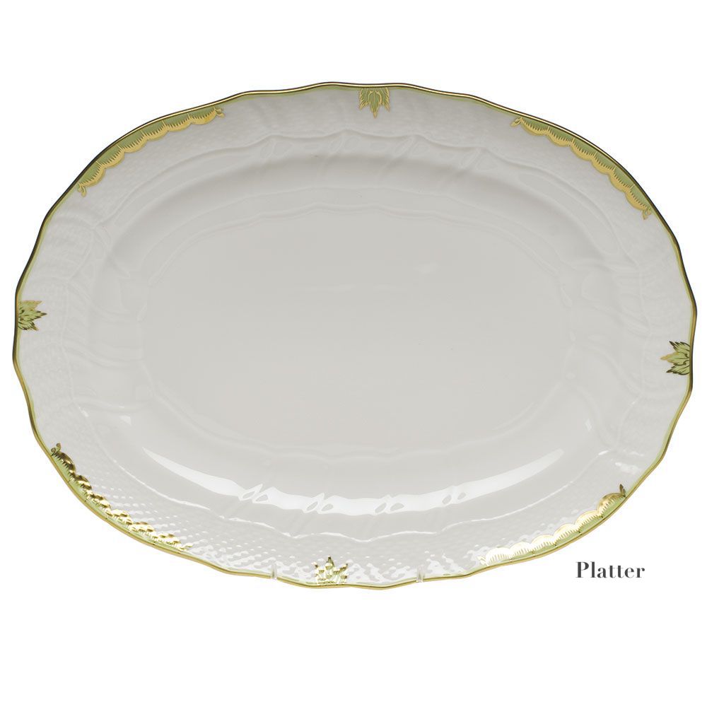 The Herend Princess Victoria Green Collection platter features white porcelain with a scalloped edge, gold trim, a subtle embossed pattern, hand-painted Queen Victoria-inspired designs, and delicate gold leaf accents around the rim.
