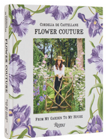 Book cover of "Flower Couture: From My Garden to My House" by Rizzoli, featuring a woman at a garden gate amid purple iris illustrations—an invitation to French-style entertaining inspired by the countryside.