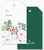 Two Equestrian Toile Gift Tags: one white with a watercolor illustration of two equestrians and three dogs in a forest with “To:” and “From:” text, and one solid dark green holiday gift tag.