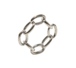 The Kim Seybert Chain Link Napkin Ring Collection features six oval-shaped, textured silver links connected in a circular design, perfect for adding an elegant touch to your table setting.