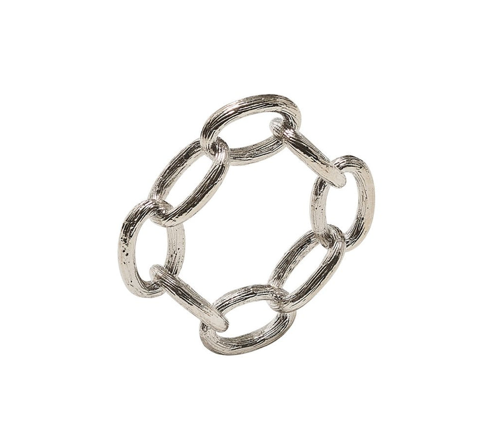 The Kim Seybert Chain Link Napkin Ring Collection features six oval-shaped, textured silver links connected in a circular design, perfect for adding an elegant touch to your table setting.