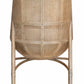 A woven McGuire Furniture Taru Side Chair with an upholstered seat, curved backrest, and wooden legs, viewed from behind.