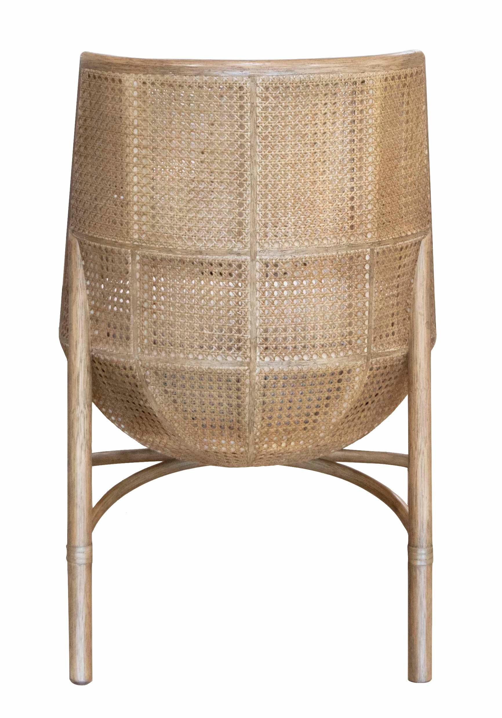 A woven McGuire Furniture Taru Side Chair with an upholstered seat, curved backrest, and wooden legs, viewed from behind.