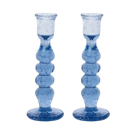 The Provence Candlestick Set by Juliska features mouth-blown blue glass candlesticks with rounded, bubble-like segments and wide bases—perfect for adding a touch of glassware charm to your decor.