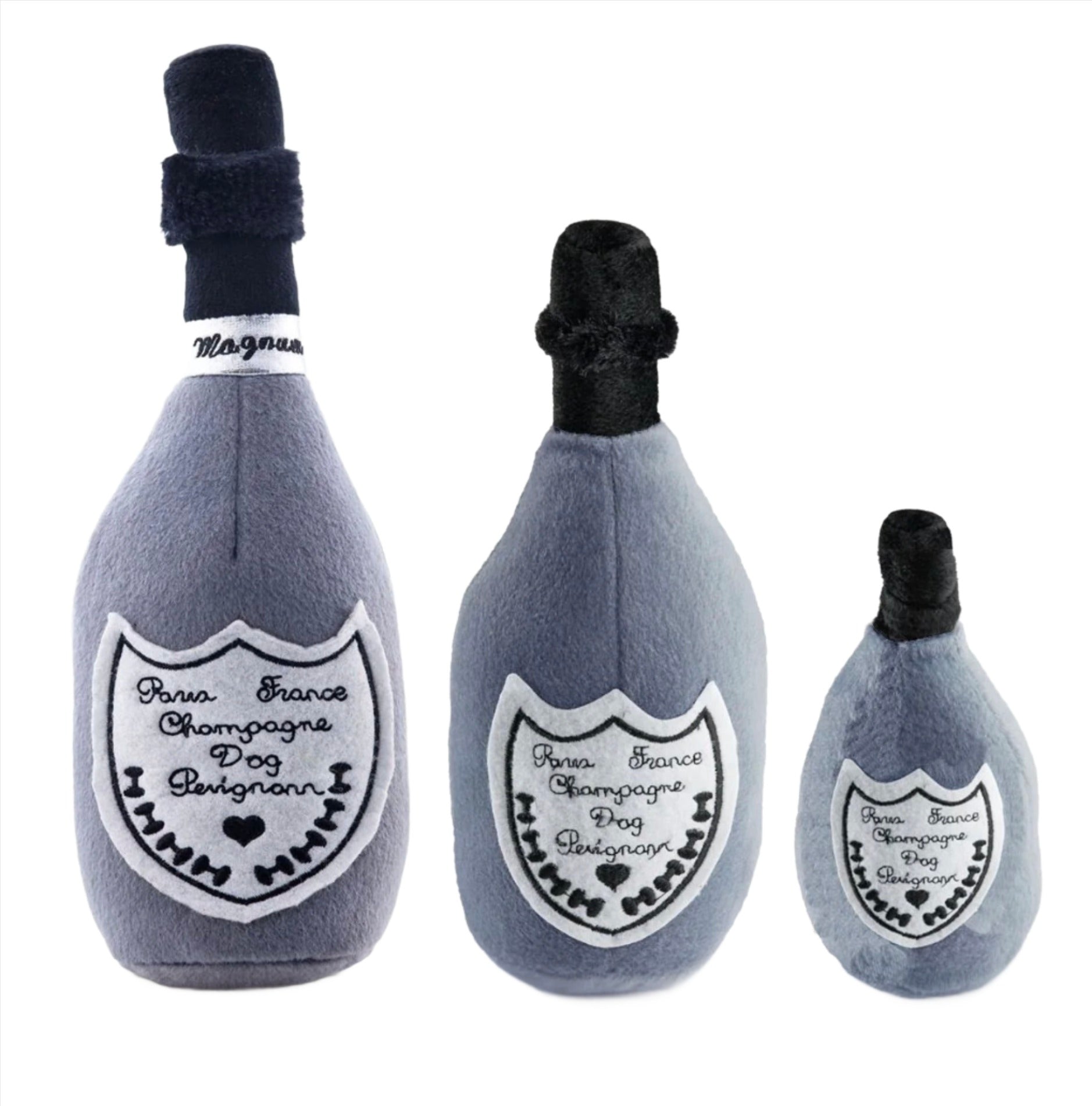 The Haute Diggity Dog "Dog Perignonn Champagne Dog Toy Collection" features three plush, squeaky toys in small, medium, and large sizes. Each is shaped like a champagne bottle with heart and bone designs for playful pups.