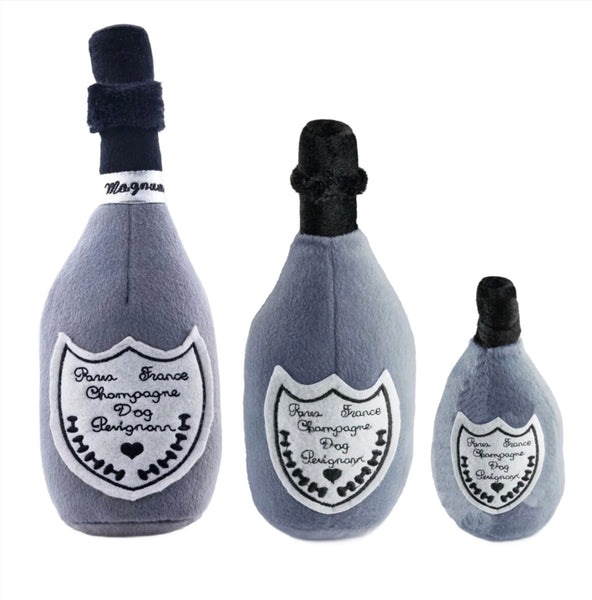 Three plush toys designed to resemble champagne bottles in various sizes from the Haute Diggity Dog Dog Perignonn Champagne Dog Toy Collection.