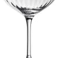 The Corinne Collection coupe by William Yeoward Crystal features clear glass with a wide, shallow bowl, elegant vertical optic pattern, long stem, and flat base—an Art Deco-inspired design set against a plain white background.