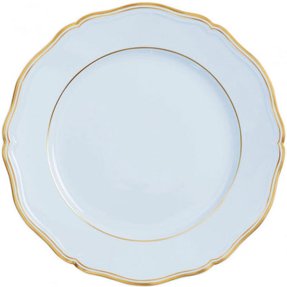 A white porcelain plate from the Raynaud Mazurka Or Fond Bleu Gris Dinnerware Collection, featuring a scalloped edge and a gold rim.