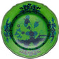 A round, scalloped-edge green plate featuring a dark blue floral and scenic pattern inspired by Ginori 1735's Oriente Italiano Malachite Dinnerware Collection.