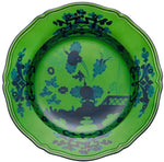 A round, scalloped-edge green plate featuring a dark blue floral and scenic pattern inspired by Ginori 1735's Oriente Italiano Malachite Dinnerware Collection.