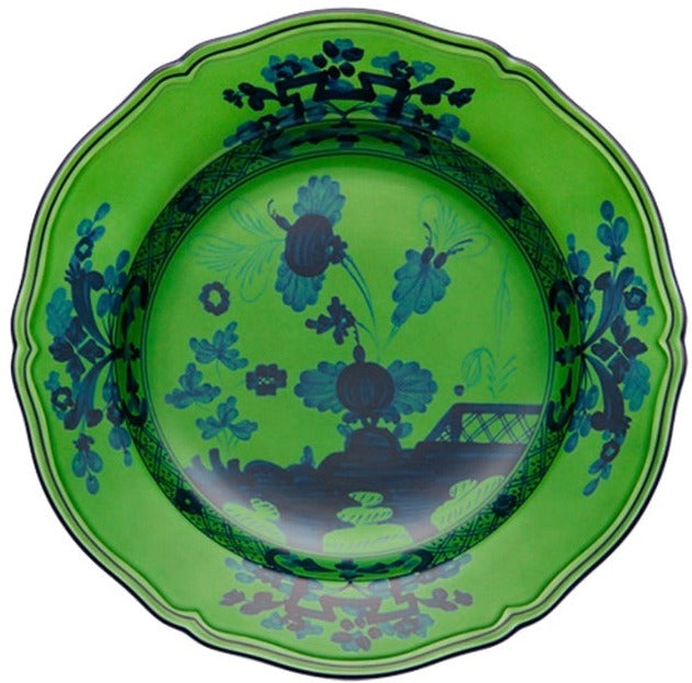 A round, scalloped-edge green plate featuring a dark blue floral and scenic pattern inspired by Ginori 1735's Oriente Italiano Malachite Dinnerware Collection.