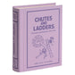 The WS Game Company Vintage Bookshelf Board Games includes a fabric-wrapped, book-shaped "Chutes and Ladders" box with vintage children’s illustrations, honoring the classic board game.