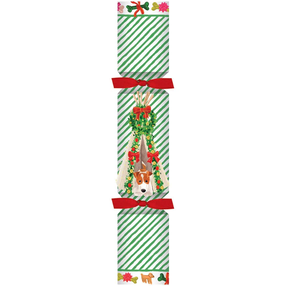 The Caspari Dog Christmas Teepee Pet Cracker features green diagonal stripes, red bows, and a festive dog with a holiday wreath at the center.