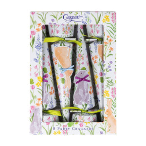 A box of eight Caspari Bunny Field Cone Crackers with floral and bunny designs, tied with green ribbons and luxury accents, presented in floral-patterned packaging.